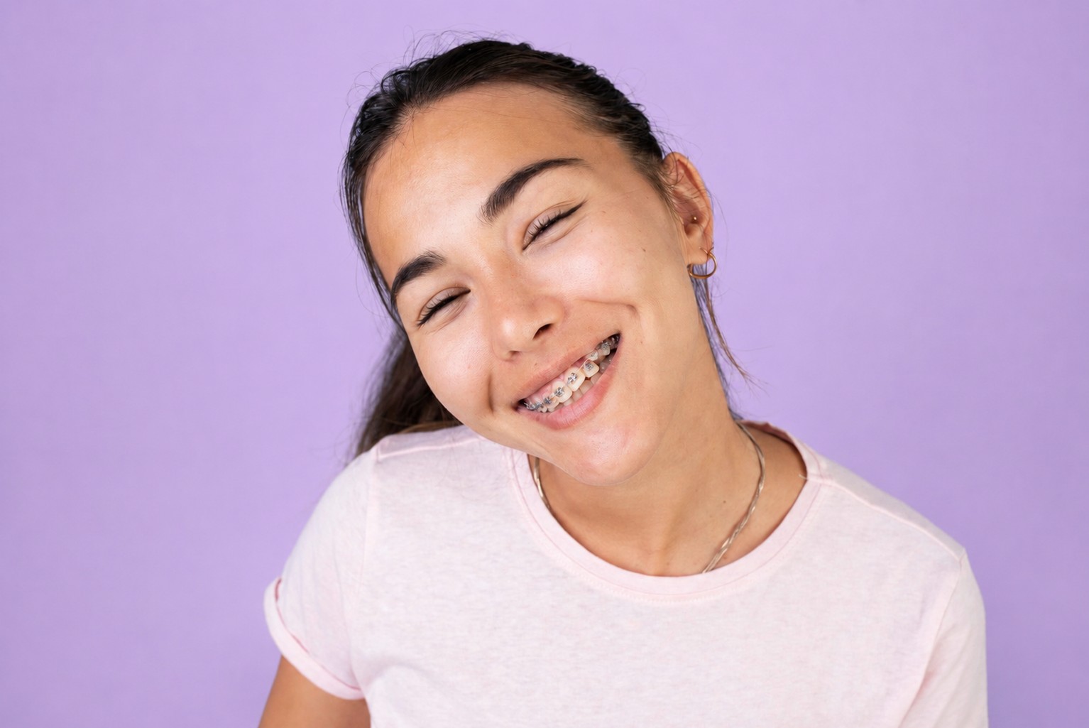 Teen girl smiling with metal braces