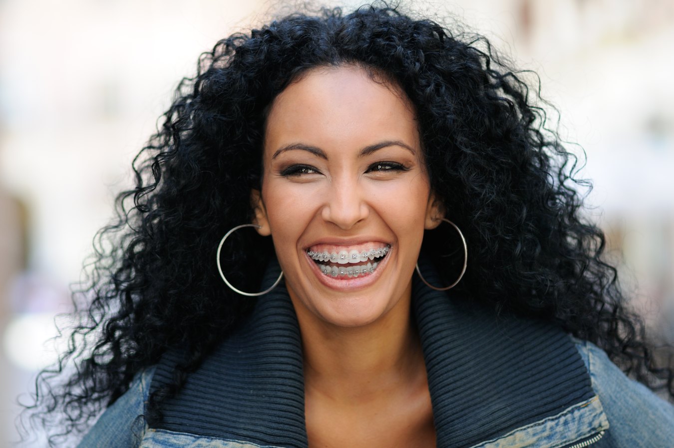 Adult woman smiling with braces